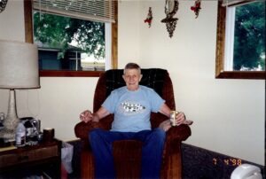 Dick Winking at home at the end of July 2nd, 1998 enjoying a cigarette and a Stag beer - feeling proud of being in business for 50 years.