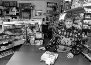 June Winking in photo featured in the Quincy Herald Whig article about Winking's Market.