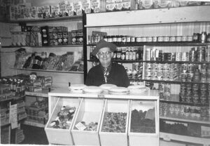 Winkings Market store in 1953 with Micky Rouse of Rouses Home Made pies. Large pies sold for 25 cents and small pies for 15 cents back then.