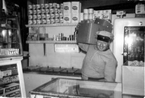 Winkings Market store in 1953 with Jimmy Kuntz the Durst Ice Cream delivery man.