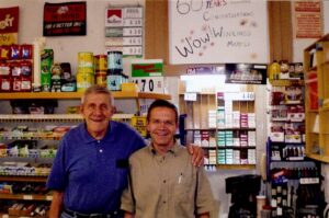 Dick and Franking Winking, father and son beaming with pride on the 60th anniversary of Winking's Market.