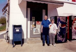 Dick and June Winking standing out in front of Winking's Market.